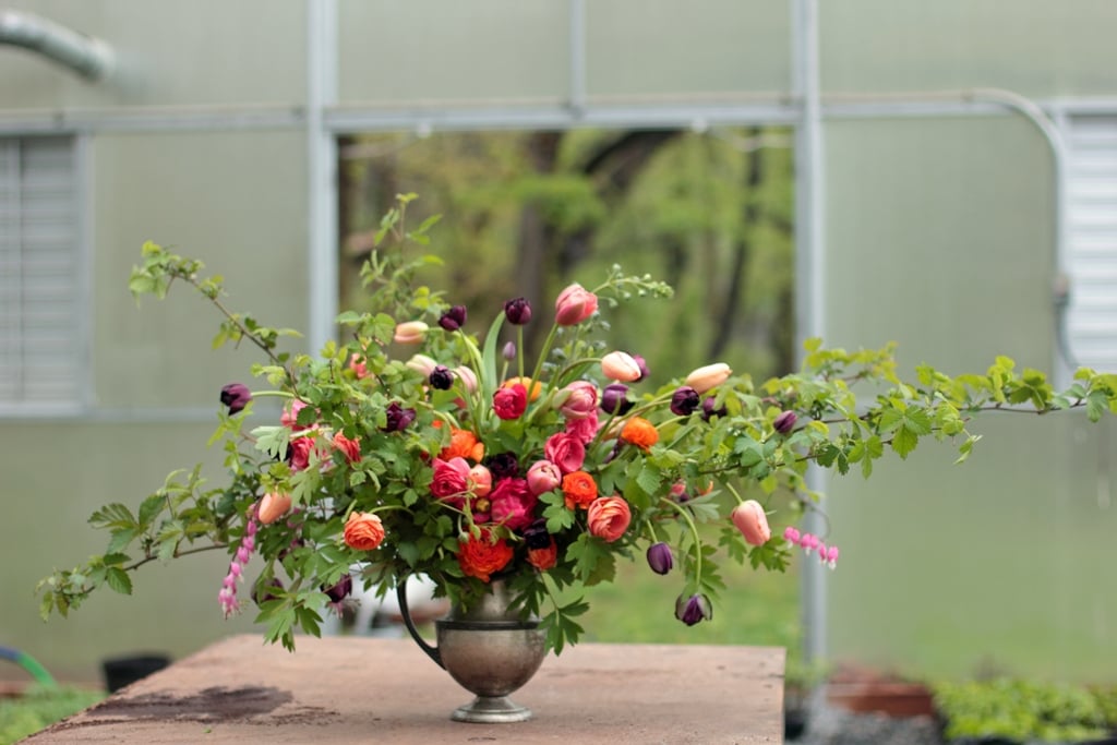 Spring arrangement with ranunculus and tulips at Love 'n Fresh Flowers